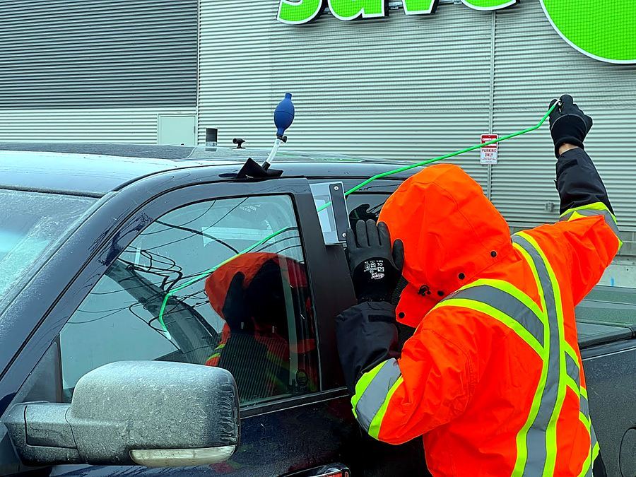 RST roadside technician helping a driver with a vehicle lockout in Calgary